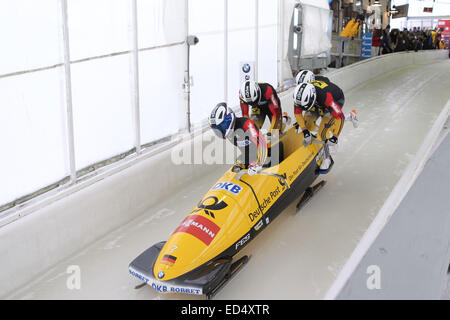 Lake Placid, NY, USA. 13th Dec, 2014. The Germany 2 bobsled driven by Francesco Friedrich with sidepushers Jan Speer and Martin Grothkopp, and brakeman Thorsten Margis slides on the track in the 4 Man Bobsled of the FIBT Bobsled and Skeleton World Cup at the Olympic Sports Complex in Lake Placid, NY. © Action Plus Sports/Alamy Live News Stock Photo