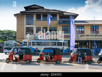 Tangalle bus and tuk tuk station with election poster of Tangalle born ruling president Mahinda Rajapaksa. Stock Photo