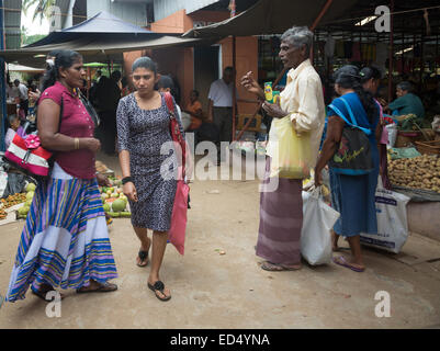 Rat poison and vegetable vendors in the market on December 17, 2014 in Tangalle, Southern Province, Sri Lanka, Asia. Stock Photo