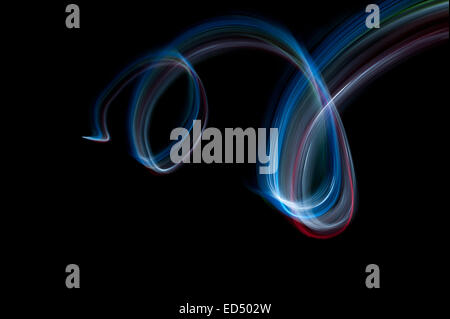 swirling spinning motion and trails traces of moving lights creating patterns vortice Stock Photo