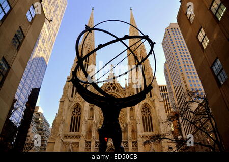 New York City:  Saint Patrick's Cathedral seen through the famed statue of Atlas Holding the World at Rockefeller Center Stock Photo