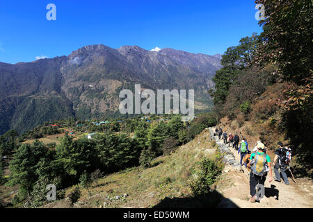 Adult Trekkers at Chineplung village on the Everest base camp trek, Sagarmatha National Park, Solukhumbu district, Khumbu Stock Photo