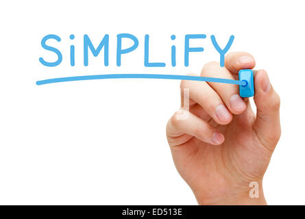 Hand writing Simplify with blue marker on transparent wipe board isolated on white.