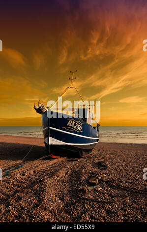 A familiar scene from Hastings in East Sussex and that is boats on the beach and this one being RX256 Stock Photo