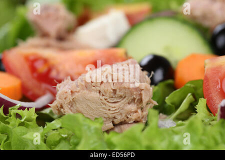 Close up tuna salad with tomatoes, carrots and olives Stock Photo