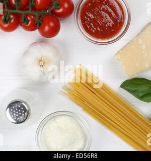 Cooking spaghetti noodles pasta food meal ingredients on wooden board Stock Photo