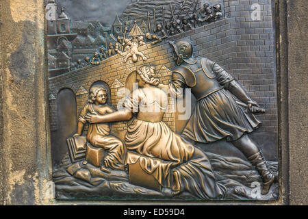 Relief below the statue of St. John of Nepomuk on Charles Bridge in Prague, Czech Republic Stock Photo