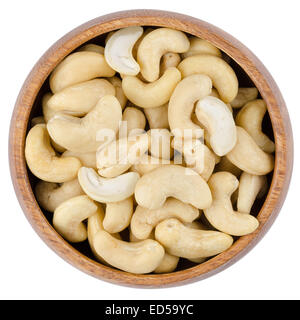 Bowl With Cashew Nuts. Raw cashew nuts in a wooden bowl from above, isolated on white background. Stock Photo