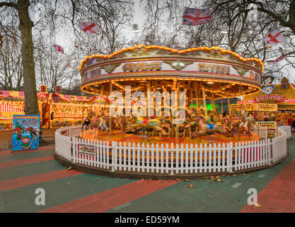 LONDON HYDE PARK WINTER WONDERLAND A SPINNING CAROUSEL  OR MERRY GO ROUND WITHOUT RIDERS Stock Photo