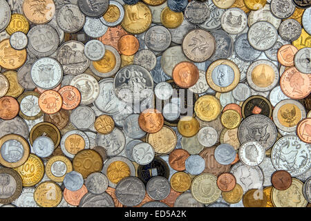 Currency - A collection of old coins from around the world. Stock Photo