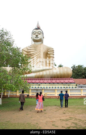 Sri Lanka's largest seated Buddha statue in Dickwella is 50 metres (160 ft) tall. Buddha and statues in buddhist monastery Wewur Stock Photo