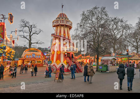 LONDON WINTER WONDERLAND IN HYDE PARK A LANE WITH HELTER SKELTER AND FOOD STALLS Stock Photo