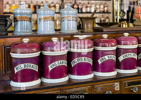 Old storage jars in pharmacy, Blists Hill Victorian town, Ironbridge, Shropshire, England, UK Stock Photo