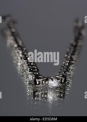 Bracelet  with diamonds on a grey background Stock Photo