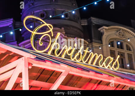 Neon Merry Christmas sign in shop window London England UK Stock Photo