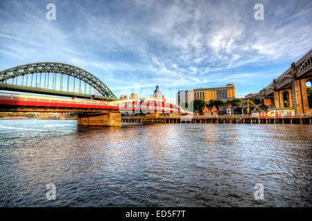 The Tyne, Low Level and High Level Bridges all on display here spanning the River Tyne as seen from Newcastle Quays. Stock Photo