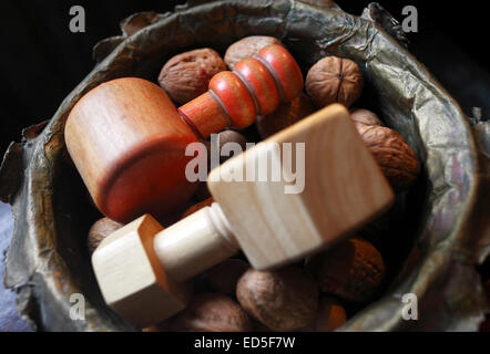 Nutcrackers and nuts in a bowl at Christmas. Stock Photo