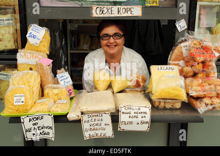 A woman at a stall selling freshly made pasta at the green market in central Belgrade, Serbia. The market is a popu Stock Photo