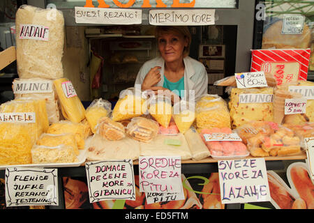 A woman at a stall selling freshly made pasta at the Zeleni Venac green market in central Belgrade, Serbia. The market is a popu Stock Photo