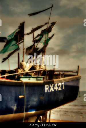 Hastings is the place to be if you want to photograph fihing boats on the beach, as in this case with the boat RX 427. Hastings  Stock Photo