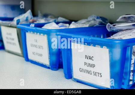 Boxes in a hospital containing IVAC pump giving sets to administer intravenous solutions to patients. Stock Photo