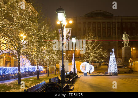 MOSCOW - DECEMBER 28, 2013: Tverskaya street illuminated for Christmas and New Year holidays, monument to king Yuriy Dolgorukiy Stock Photo