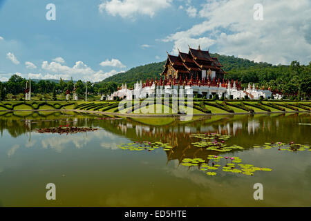 Royal Pavilion reflected on pond with lily pads, Royal Park Rajapruek, Chiang Mai, Thailand Stock Photo