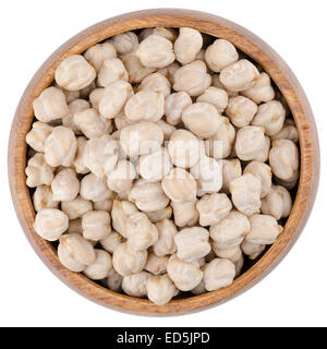 White Chickpeas in a Bowl. White chickpeas in a wooden bowl from above, isolated on white background. Stock Photo