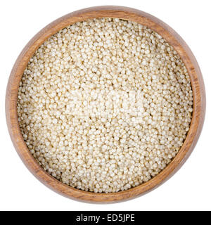 Quinoa Seeds in a Bowl. Raw quinoa seeds in a wooden bowl from above, isolated on white background. Stock Photo