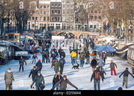 Amsterdam Ice Skating on a frozen Canal in winter. Keizersgracht and Brouwersgracht Canals Stock Photo