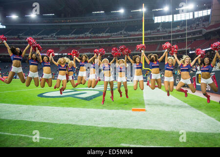 Houston, Texas, USA. 28th Dec, 2014. Houston Texans Cheerleaders leap after an NFL game between the Houston Texans and the Jacksonville Jaguars at NRG Stadium in Houston, TX on December 28th, 2014. The Texans won the game 23-17. Credit:  Trask Smith/ZUMA Wire/Alamy Live News Stock Photo