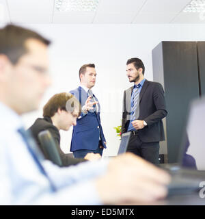 Business people in modern office. Stock Photo