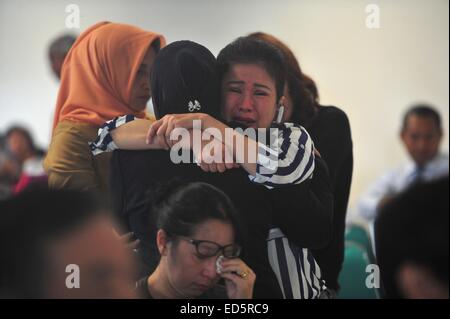 Surabaya, Indonesia. 29th Dec, 2014. Family members of passengers on AirAsia Flight QZ8501 gather at Juanda International Airport in Surabaya, Indonesia, Dec. 29, 2014. Air Asia Indonesia has released information about the 162 passengers and crew members on Flight QZ8501, which lost contact with the air traffic control Sunday morning. Credit:  Zulkarnain/Xinhua/Alamy Live News Stock Photo