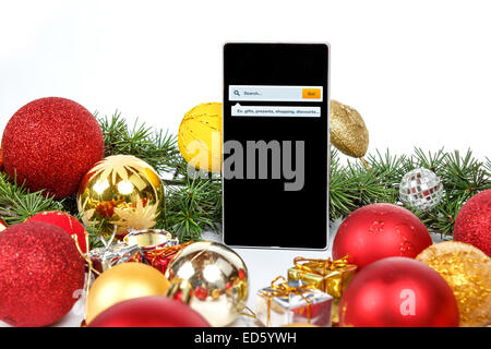 Christmas and New year shopping online , Mobile phone in holiday gift concept , Internet search for new year presents Stock Photo