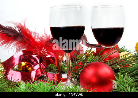 Romantic composition of Christmas with glasses of wine and ornaments , Holiday romance , New year decoration with wine glasses Stock Photo