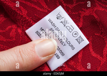 label showing washing instructions in garment - care washing symbols and instructions Stock Photo