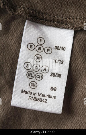 made in Mauritius label in garment showing sizes in different countries - sold in the UK United Kingdom, Great Britain Stock Photo