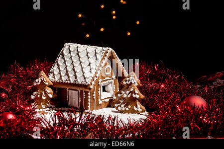 Holiday Gingerbread house on dark background, christmas cookie Stock Photo