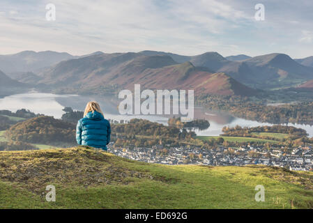 Hiker enjoying the view from Latrigg over Keswick and Derwent Water to Cat Bells in the English Lake District Stock Photo