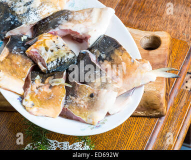 pieces of carp fish in marinade ready for frying Stock Photo