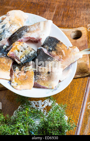 pieces of carp fish in marinade ready for frying Stock Photo