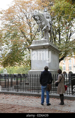 Paris tourist looking man riding horse statue Place des Vosges Stock Photo