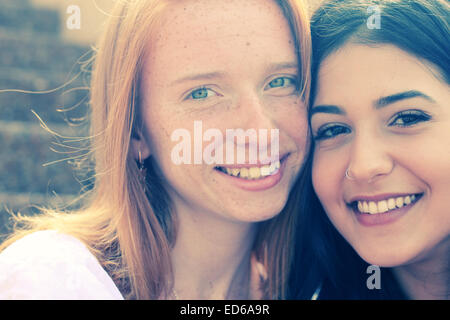 portrait of two smiling girlfriends Stock Photo