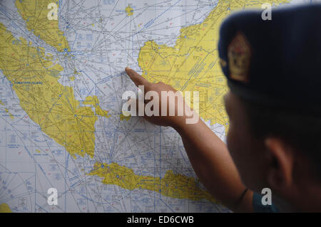Surabaya, East Java, Indonesia. 29th Dec, 2014. An Indonesia Air Force show map to the search and rescue for missing of AirAsia flight QZ8501 at Juanda Airport.The missing AirAsia Indonesia flight QZ8501 is likely to be at the bottom of the sea, the head of Indonesia's search-and-rescue agency has said. Bambang Soelistyo said the hypothesis was based on the co-ordinates of the plane when contact with it was lost. The search for the Airbus A320-200, which disappeared with 162 people on board on Sunday on a flight to Singapore, has ended for a second day. The search area will be widened on Tues Stock Photo