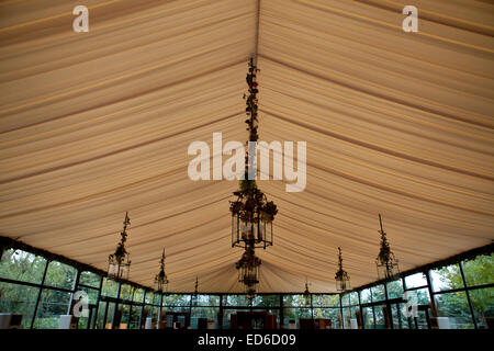 Chandeliers on an tents ceiling in a wedding party Stock Photo