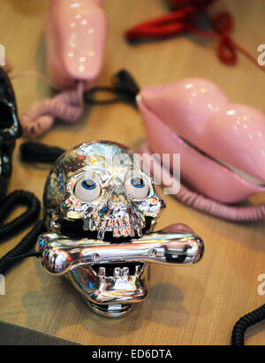 Phone skull with a pipe in his mouth Stock Photo