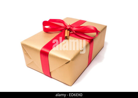 present with red loop and cinnamon stick Stock Photo