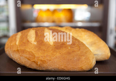 domestic loaf bread on brown plate closeup Stock Photo