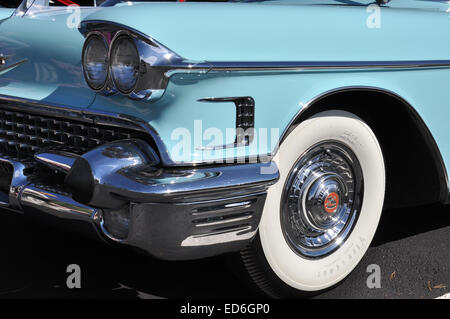 The front of a 1958 Cadillac showing chrome and white wall tires. Stock Photo