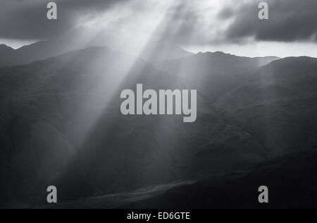 Crepuscular rays over mountains in the English Lake District national park Stock Photo